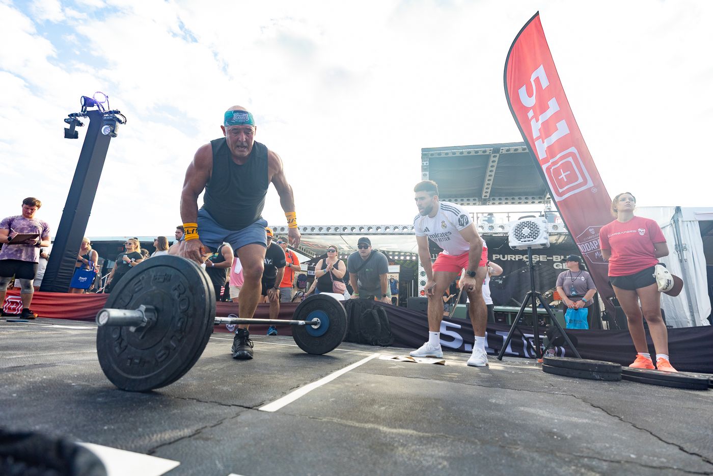 A deadlift challenge at the 5.11 Tactical activation, with 5.11 flags behind