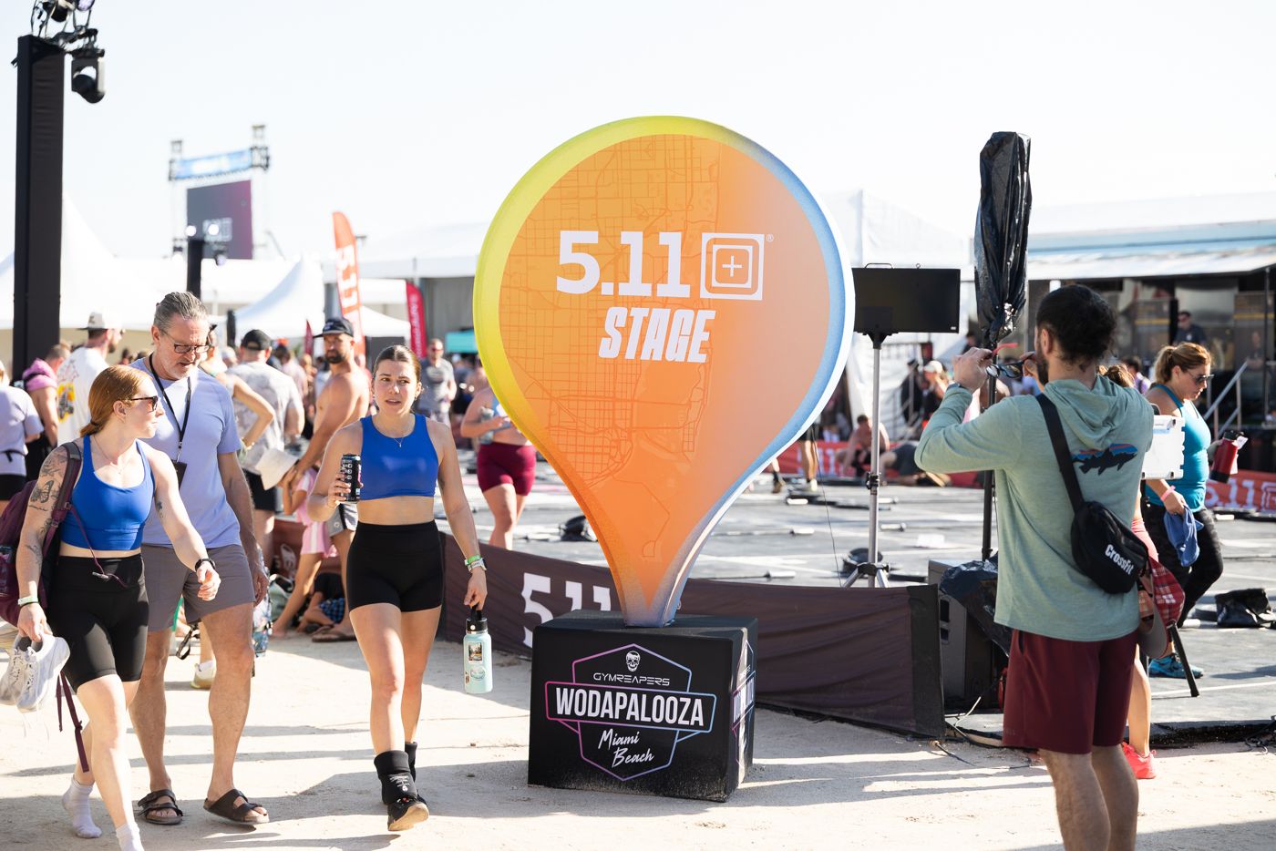 The 5.11 Stage marker with festival crowds walking past