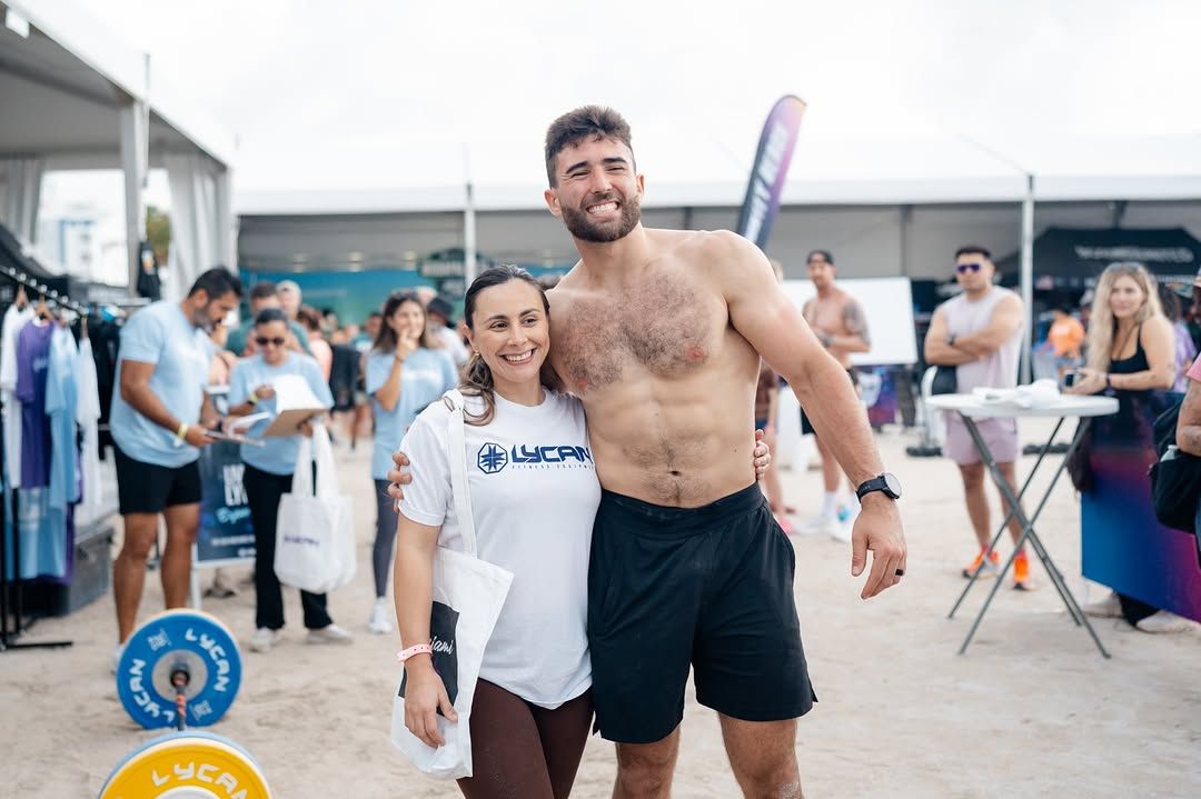 Athletes and fans at the Lycan Fitness booth