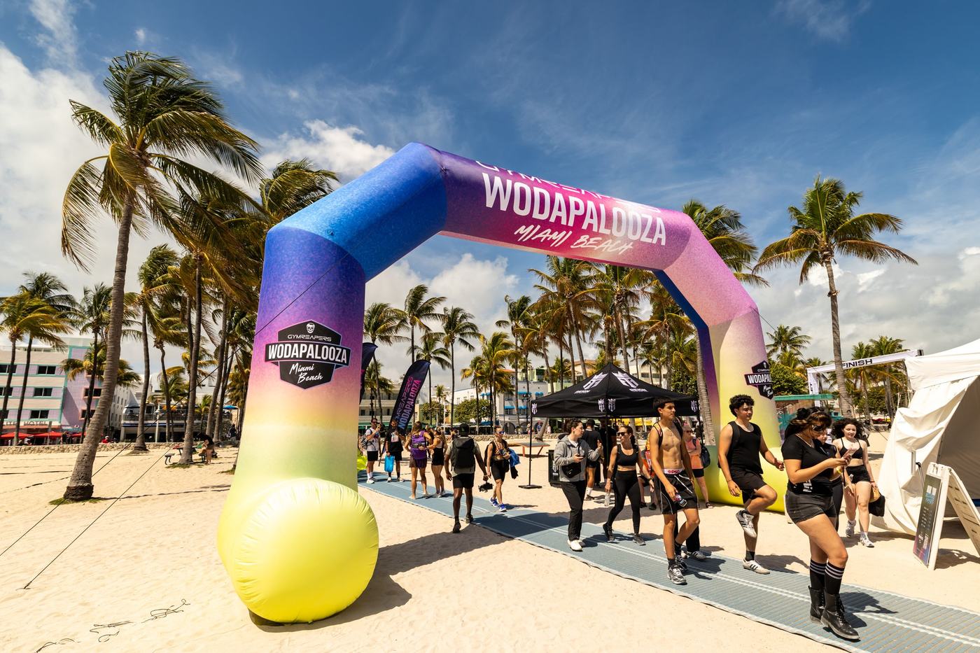 Inflatable entrance arch with fans walking through